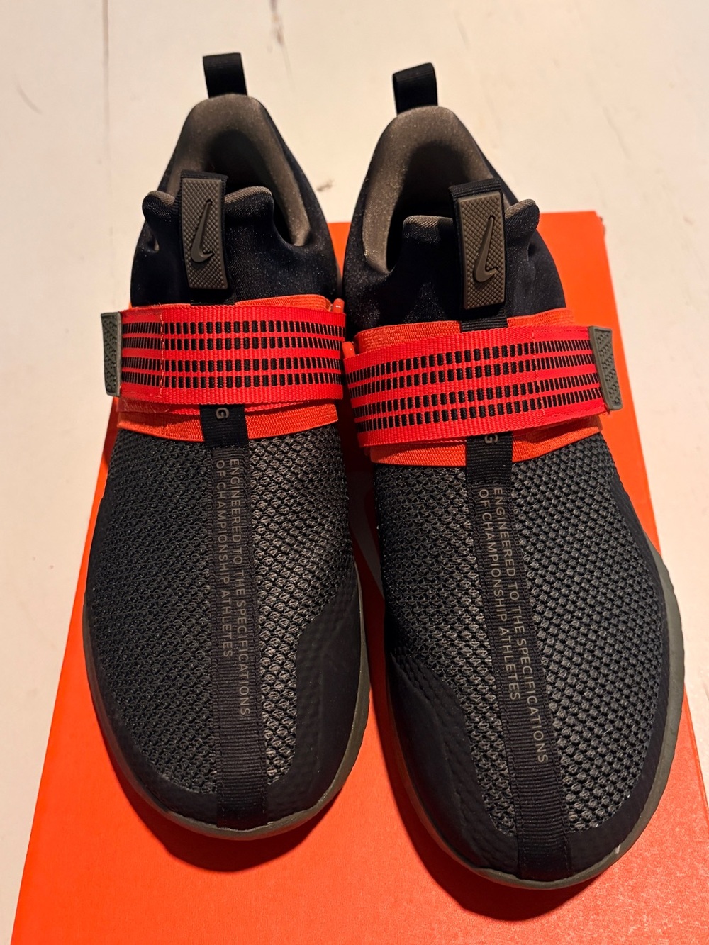Nike Men’s Black Slip-On Sneakers with Red Straps